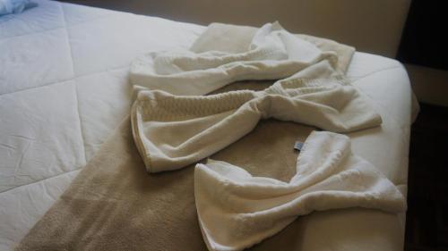 Ένα ή περισσότερα κρεβάτια σε δωμάτιο στο Hotel Mazzuco