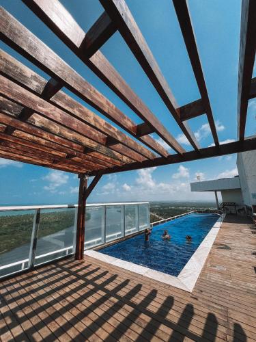 a swimming pool on the roof of a building at Silverton Paiva Experience in Recife