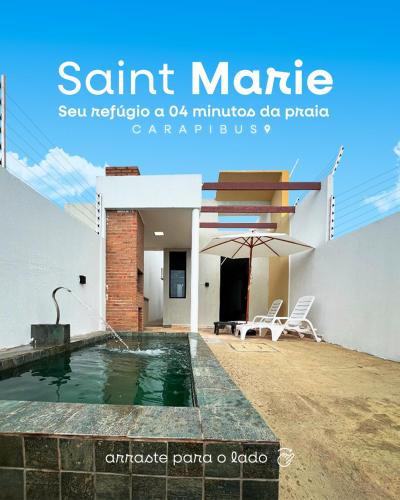 a swimming pool in the backyard of a house at 01 - Saint Marie Beach House in Conde
