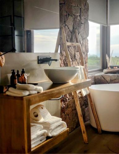 a bathroom with a counter with a bowl on it at La Singladura in La Población