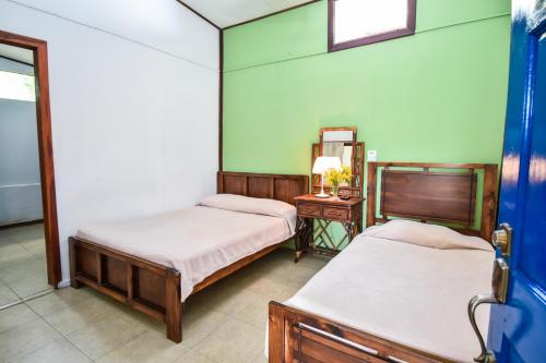 Postel nebo postele na pokoji v ubytování Cabinas Jacaranda