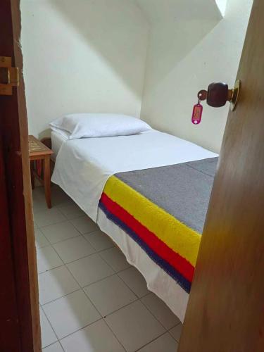 Postel nebo postele na pokoji v ubytování Ecohotel Otrolado Lodge