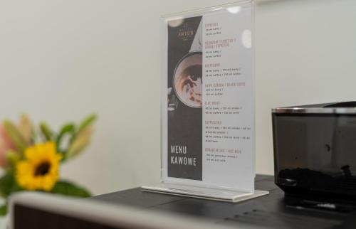 a sign sitting on top of a table at Hotel Artur in Kraków