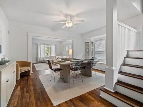 a dining room and living room with a table and chairs at 19th Century 'Cleveland Double' - Walk To Beach in Cleveland
