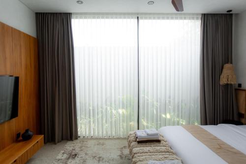 Ένα ή περισσότερα κρεβάτια σε δωμάτιο στο Rahya Villas Complex