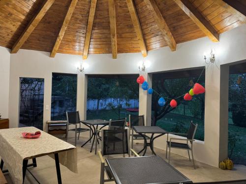 a dining room with tables and chairs and balloons at Pensiunea Sun Victor in Baile Felix