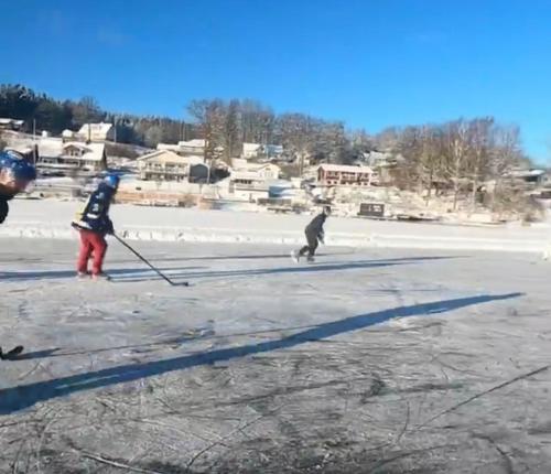 two people are skiing on the ice at New house by the lake Bunn & private bathing jetty in Gränna