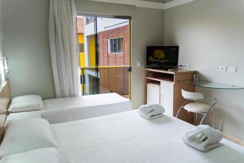 Katil atau katil-katil dalam bilik di Marruá Hotel