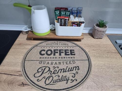 a sign that says coffee preparedrants premium quality on a table at Skopje-Modern, home apartment-Kozle in Ždanec