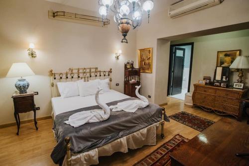 Кровать или кровати в номере Villas D'Egypte