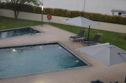 Πισίνα στο ή κοντά στο Holiday Inn Express Guadalajara Expo by IHG