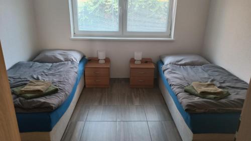 Ένα ή περισσότερα κρεβάτια σε δωμάτιο στο Apartmány Solka