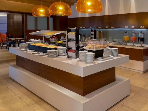 a buffet line in a restaurant with food on display at Holiday Inn Express Mérida by IHG in Mérida
