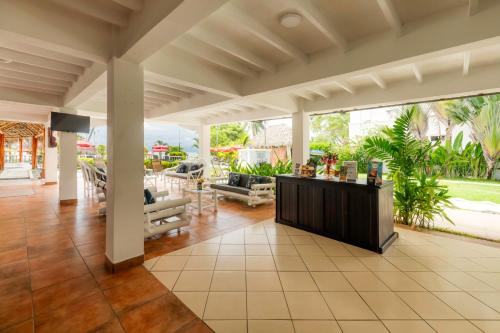 a living room with a counter in a house at Jaco Laguna Resort & Beach Club in Jacó