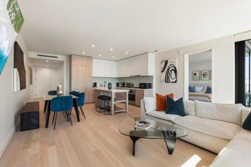 a living room with a couch and a table at The Rose Quartz - Rooftop Pool, Gym Glamorous Santa Monica 2BR in Los Angeles