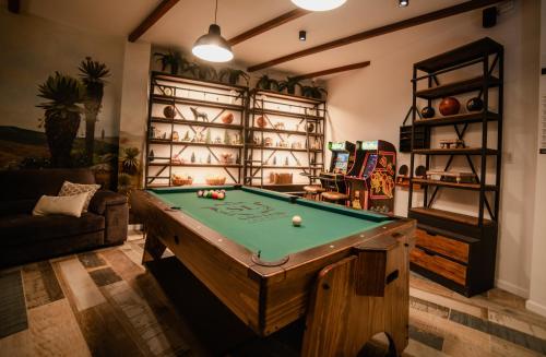 a living room with a pool table in it at Hotel Boutique San Luis Mongui in Monguí