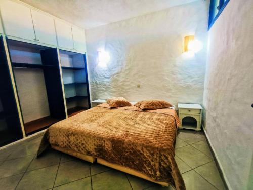 Tempat tidur dalam kamar di P1 duplex vue sur Mer