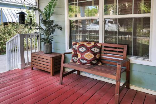 a porch with a bench and a potted plant at Pearl - A Birdy Vacation Rental in San Antonio