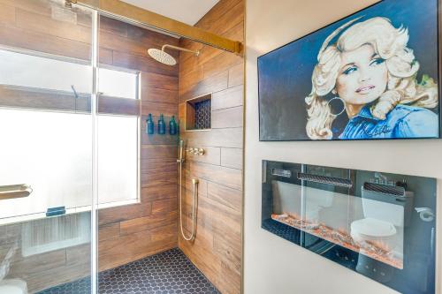 a bathroom with a shower and a painting on the wall at Colorado River Getaway in Parachute Dogs Welcome! in Parachute