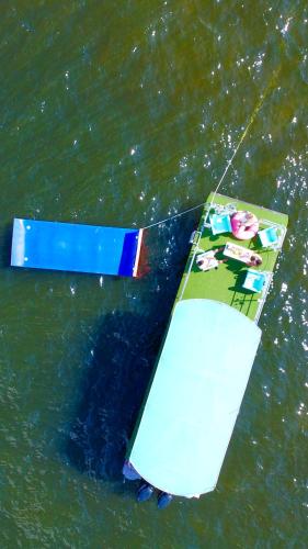 a surfboard in the water on the ground at Lux House Heated Spa & Free Boat Tour! in Fort Lauderdale