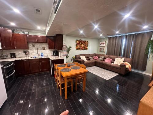a kitchen and a living room with a table and a couch at Great Condominium Lower level in Salt Lake City