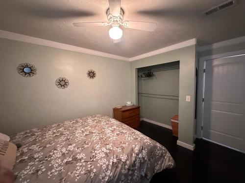 a bedroom with a bed and a ceiling fan at Great Condominium Lower level in Salt Lake City