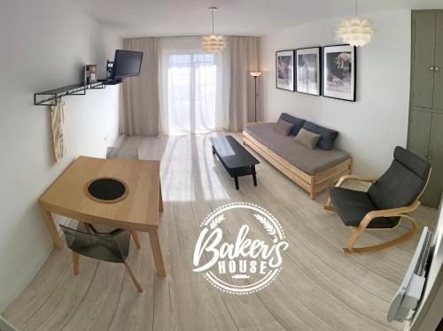 a living room with a couch and a table at Baker's house in Clermont-Ferrand