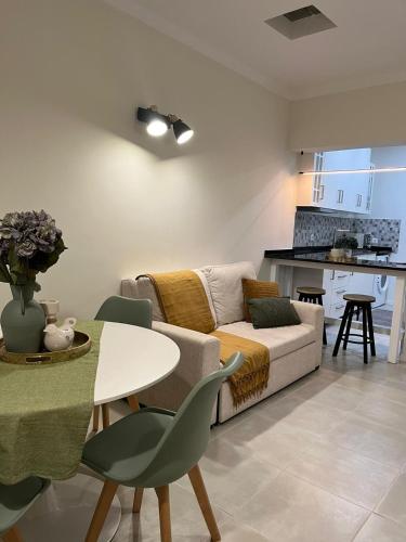 a living room with a couch and a table at Atlantis Azor I in Angra do Heroísmo