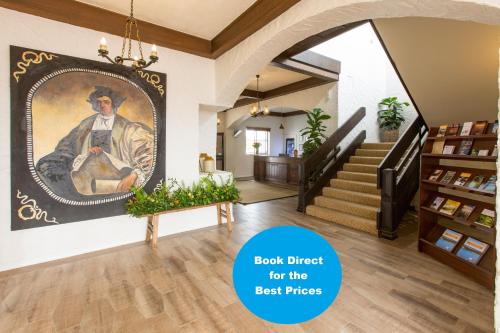 a room with a painting of a man holding a guitar at The Matador in Sale