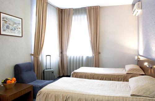 Postel nebo postele na pokoji v ubytování DITER Family Hotel