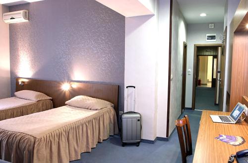 Postel nebo postele na pokoji v ubytování DITER Family Hotel