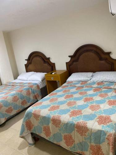 Postel nebo postele na pokoji v ubytování Departamento en Plaza zafa