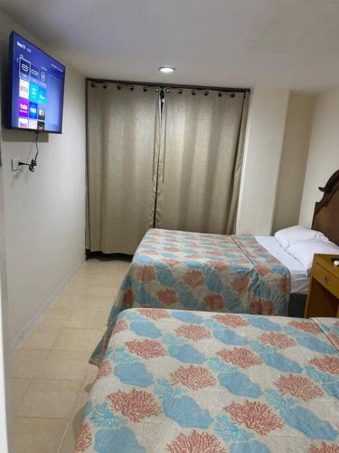 Postel nebo postele na pokoji v ubytování Departamento en Plaza zafa