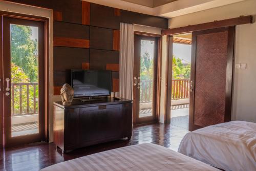 Кровать или кровати в номере Bali Stile villa