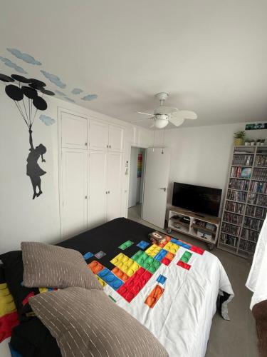 a living room with a bed with blocks on it at FLAT Surrounded by Nature WIFI & Pool & beach Nearby in Son Parc