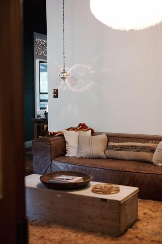 a living room with a couch and a coffee table at Baxter Lodge - Hinterland Country Luxury in Mapleton