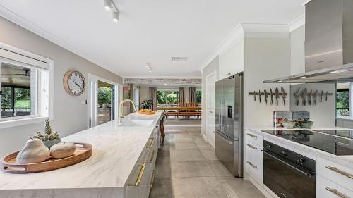 a kitchen with a large island with a counter top at Mount Gibraltar Retreat in Mittagong