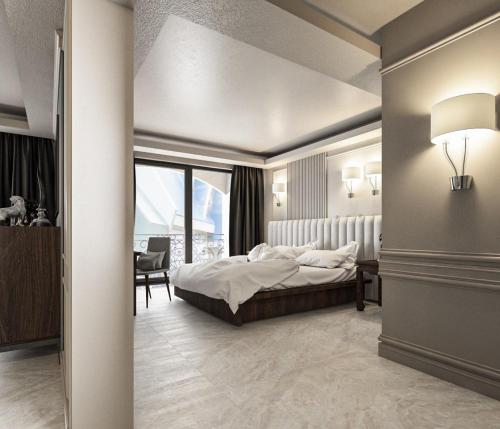 Postel nebo postele na pokoji v ubytování Grand Orlov Apart Hotel