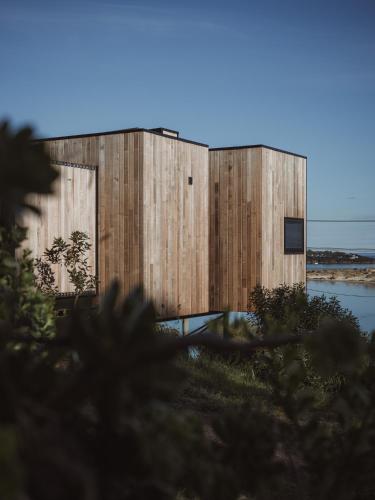 a building with wood panels on the side of it at The Tailored Pod - A Compact Oasis in Lewisham