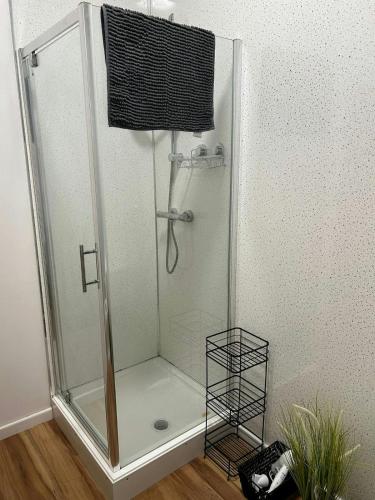 a shower with a glass enclosure in a bathroom at City-Centre Studio · Self-Contained · Sleeps 3 in Nottingham
