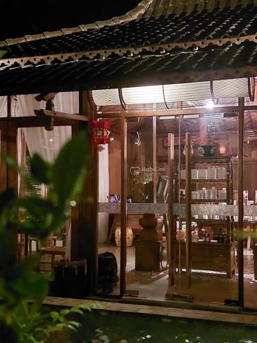 a shop with a glass window in a building at Sojourn Spa Hotel Melaka in Melaka
