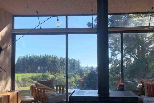 a living room with a large glass window at Casa Puertecillo in Puertecillo