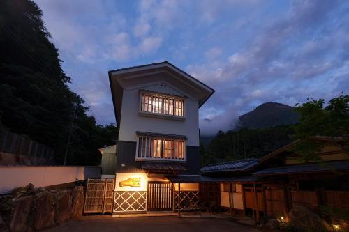 a house with two windows on the side of it at 【Newly Opened】Yufuin Geihinkan Kura in Yufuin