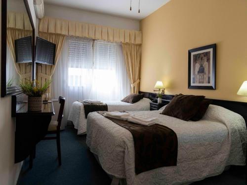 Postel nebo postele na pokoji v ubytování Hotel Centro