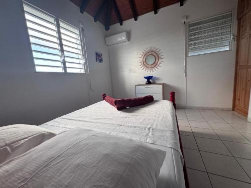 Katil atau katil-katil dalam bilik di Villa paradisiaque