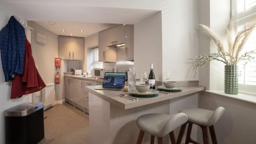 a kitchen with a counter with a laptop on it at Easy Reach in Ambleside