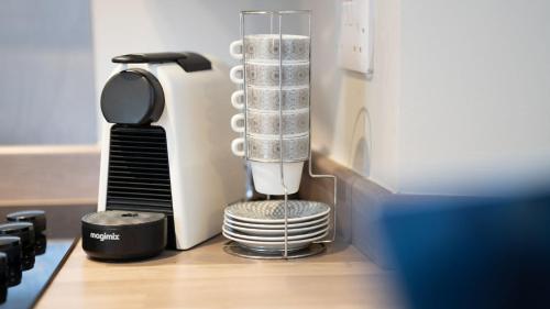 a blender sitting on a table next to a keyboard at Easy Reach in Ambleside