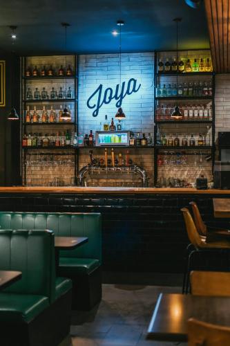 a restaurant with a bar with a sign that says yocom at La Joya Hostel in Valparaíso
