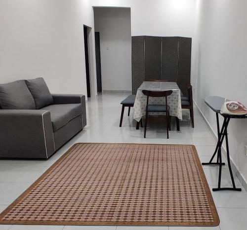 a living room with a couch and a table at AKASIA Homestay Segamat in Segamat