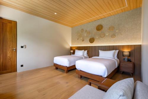Ένα ή περισσότερα κρεβάτια σε δωμάτιο στο Sinae Residence